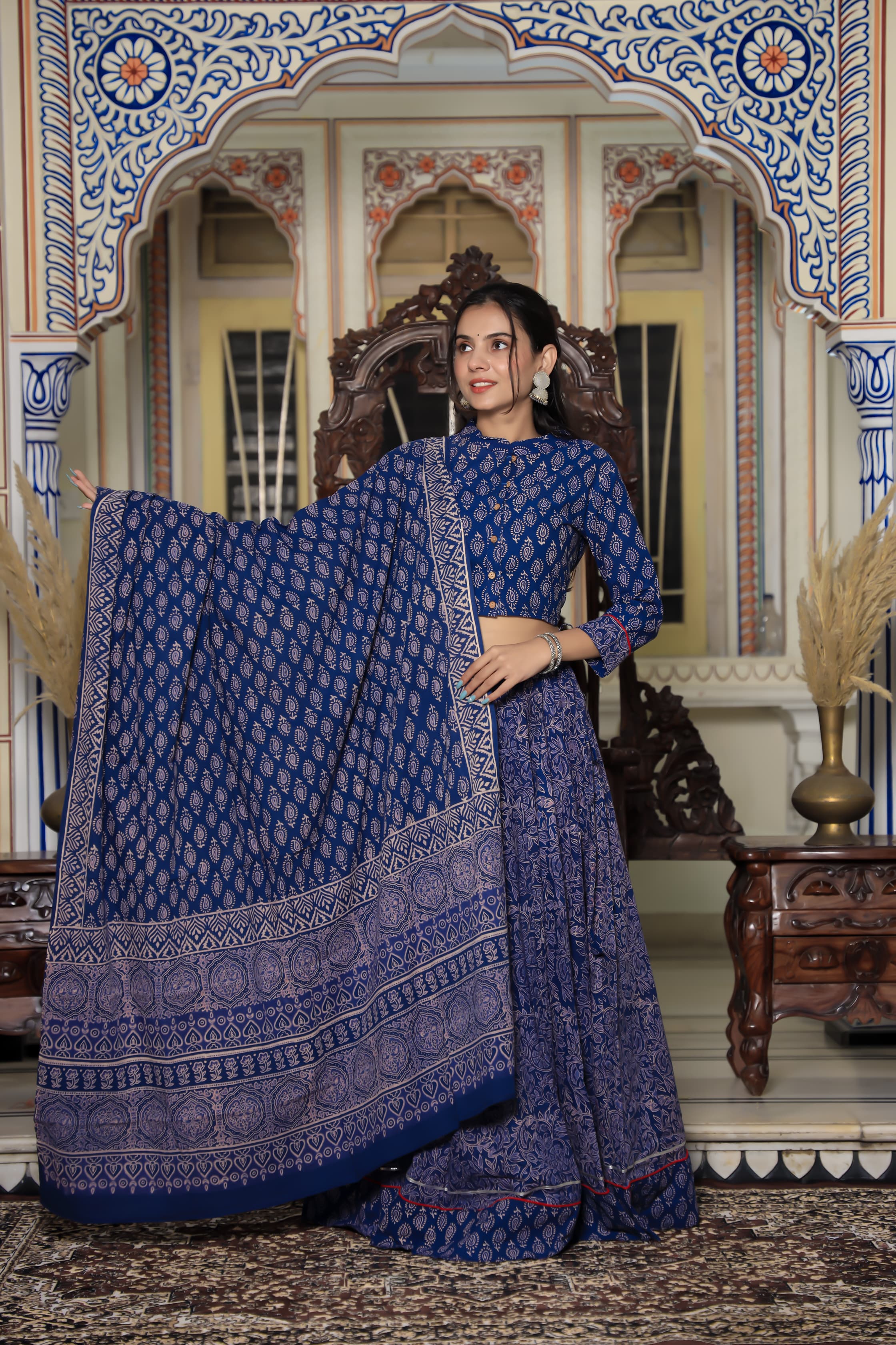 Majestic Blue Bagru Hand Leaf Printed Couple Set – Vibrant Chaniya Choli with Vibrant Skirt & Elegant Mulmul Dupatta | Matching Regal Men’s Kurta with Classic White Payzama