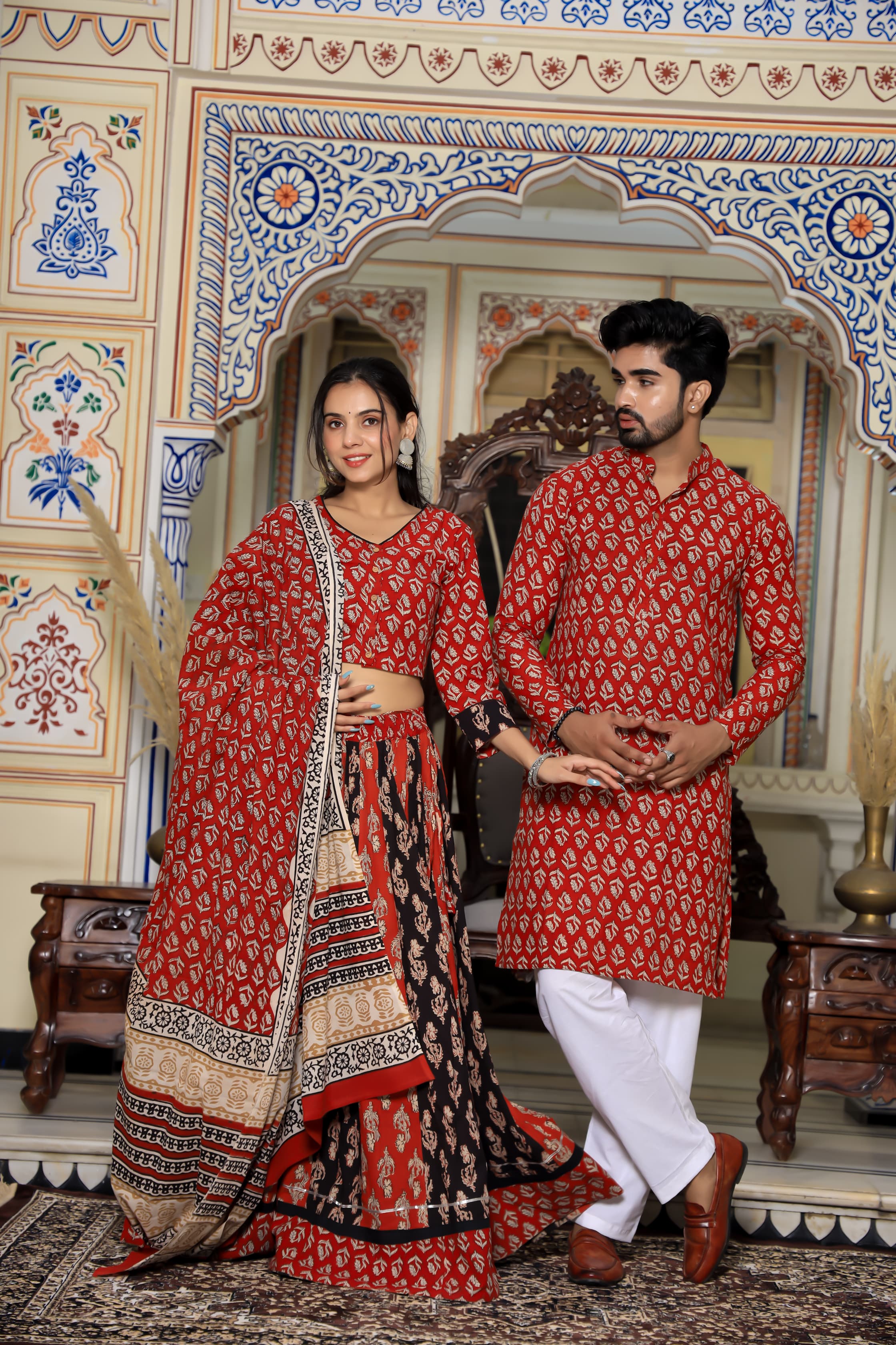 Majestic Red Bagru Hand Block Printed Couple Set – Vibrant Chaniya Choli with Multicolored Skirt & Elegant Mulmul Dupatta | Matching Regal Men’s Kurta with Classic White Payzama