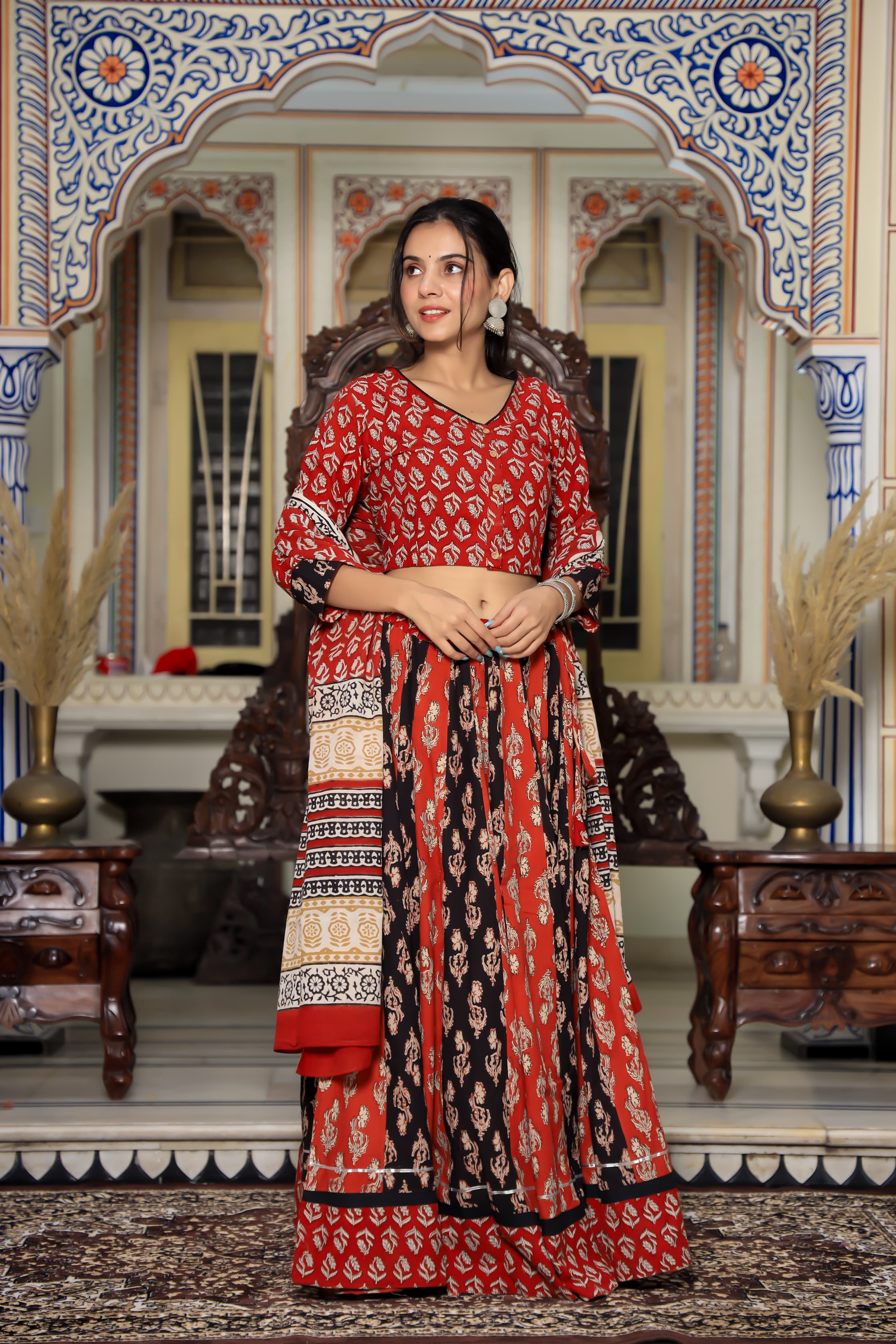 Majestic Red Bagru Hand Block Printed Couple Set – Vibrant Chaniya Choli with Multicolored Skirt & Elegant Mulmul Dupatta | Matching Regal Men’s Kurta with Classic White Payzama