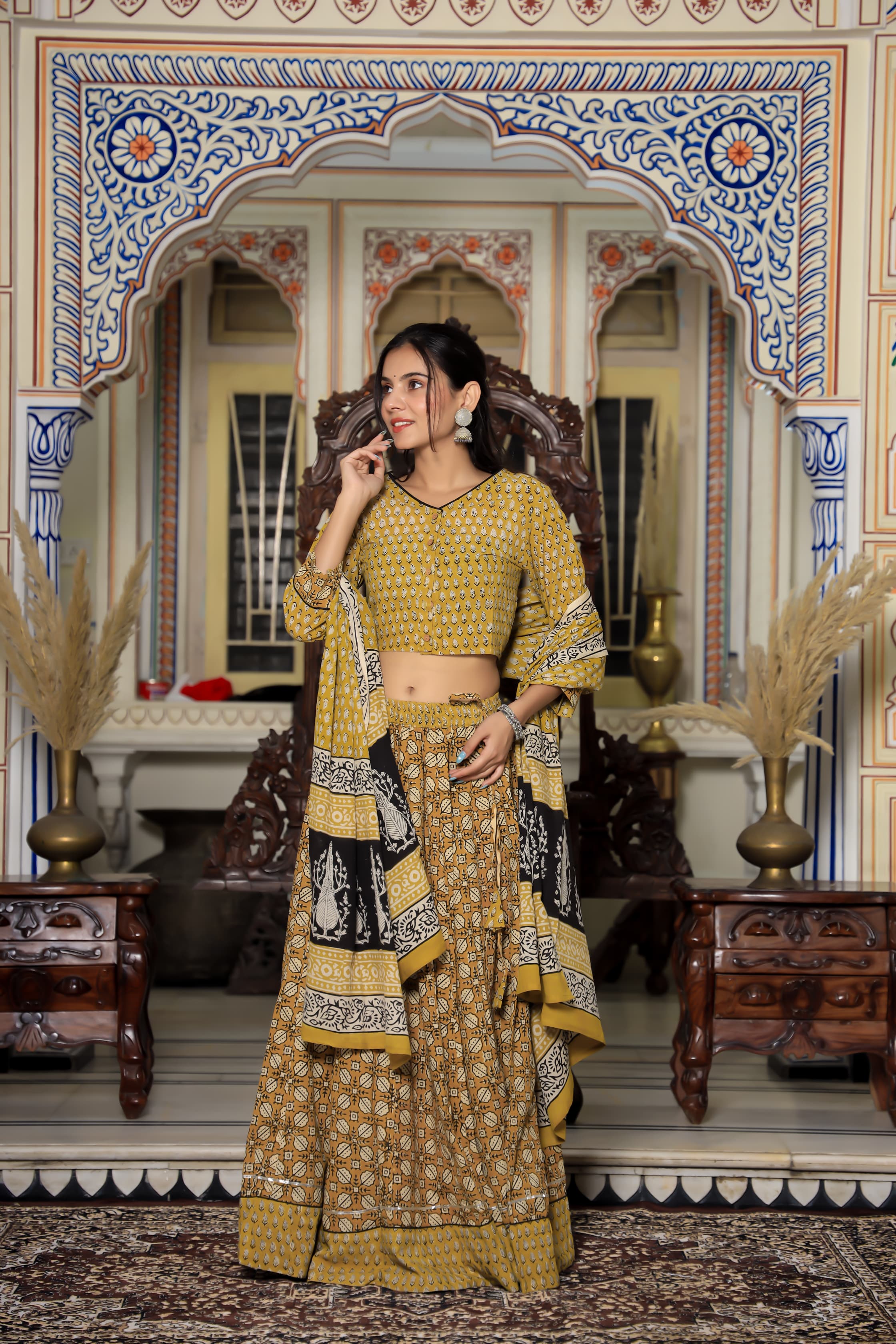 Majestic Yellow Bagru Hand Printed Couple Set – Vibrant Chaniya Choli with Multicolored flowerd Skirt & Elegant Mulmul Dupatta | Matching Regal Men’s Kurta with Classic White Payzama